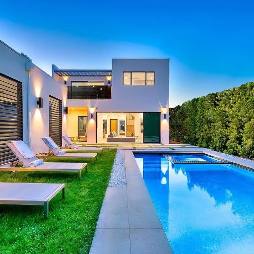 Modern house with pool and lounge chairs